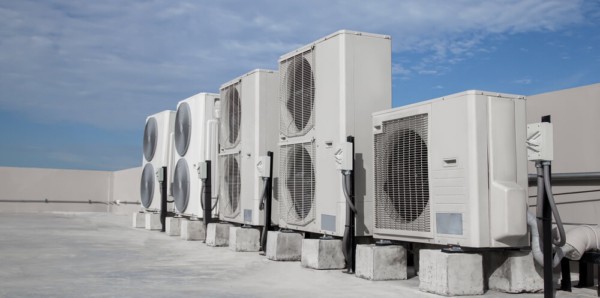 Inspect HVAC units for commercial roof maintenance 