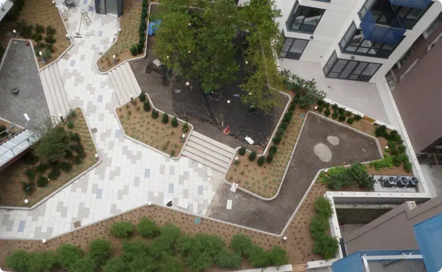Aerial view of landscaped courtyard, 800 10th Avenue, surrounded by commercial roofs.