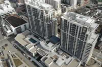 Aerial view of commercial rooftop structures, Boston urban landscape.