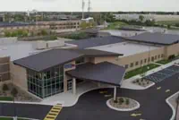 Aerial view of Milwaukee modern building with dark roof and large windows