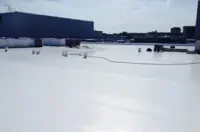 Flat white commercial roof with equipment, Dallas, TX.