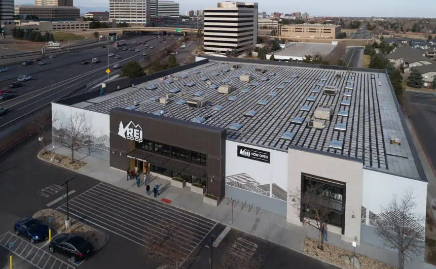 Aerial view of REI store with solar panels and parking lot