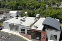 Aerial view of "Fire House" with commercial flat roof, Boston.