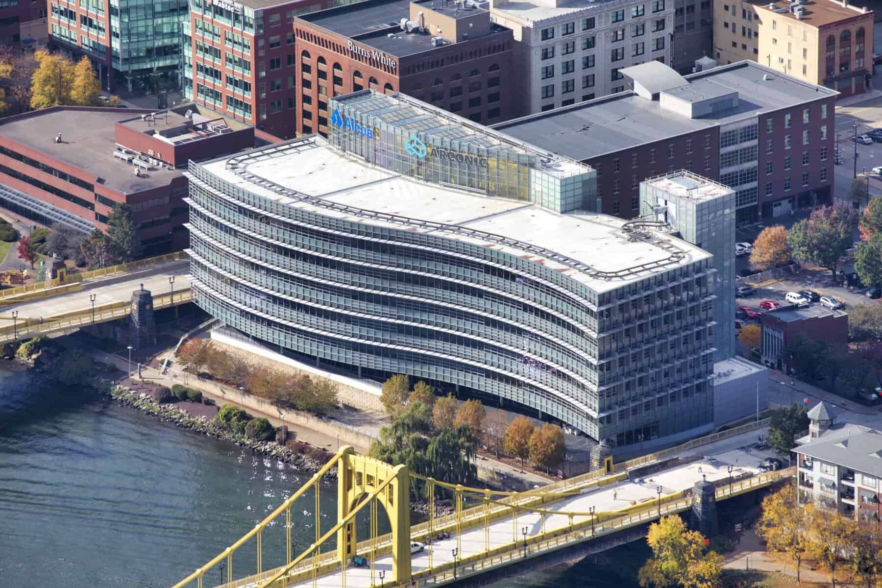 Aerial view of PNC's modern office with Built-Up Roof by the river.