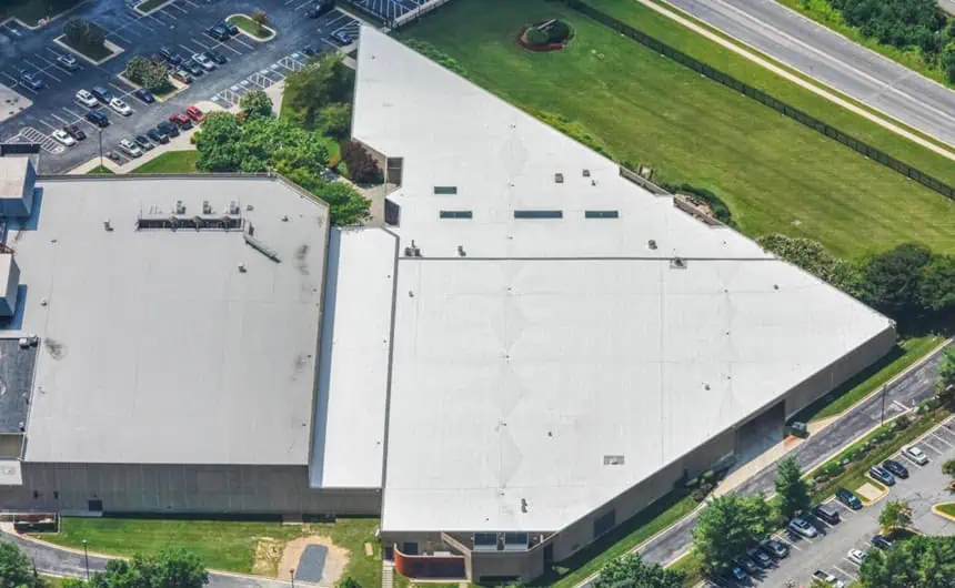 Aerial view of a white-roofed data center ideal for TPO roofing.