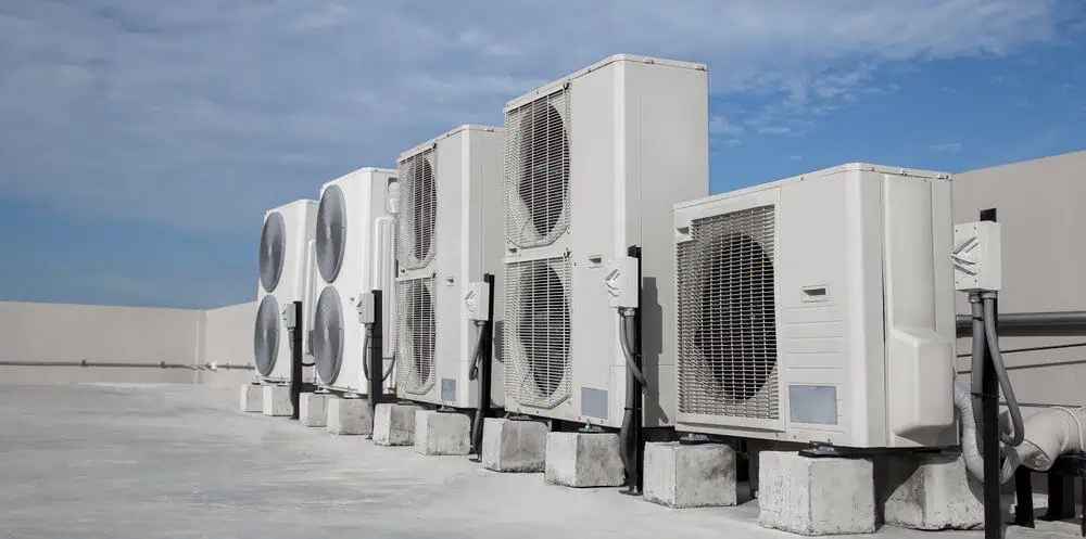Inspect HVAC units for commercial roof maintenance 