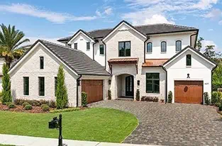Modern two-story Florida home: white exterior, brown shingle roof, wooden garage doors.
