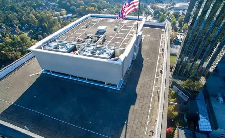 Aerial view of HVAC units on commercial rooftop with Resurgens Plaza in background