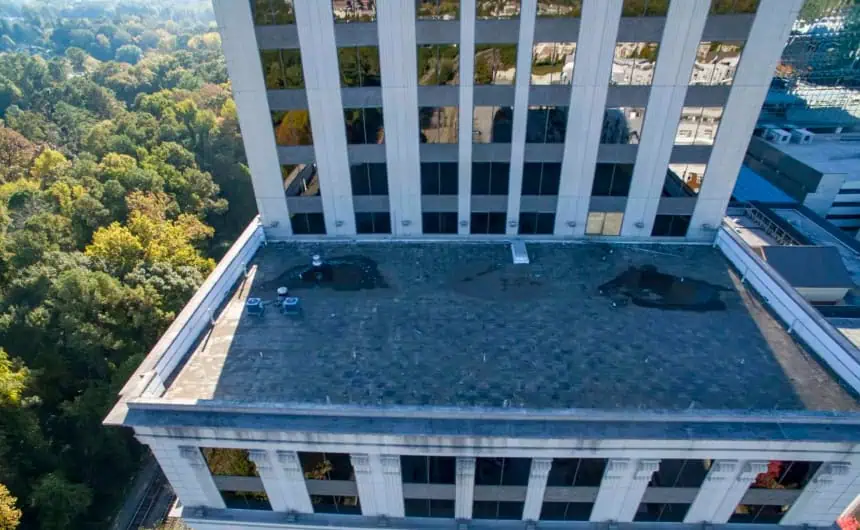 Aerial view: Flat rooftop of Resurgens Plaza, commercial building roofing.