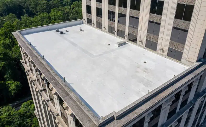 Aerial view of Resurgens Plaza's white TPO flat roof and vents.