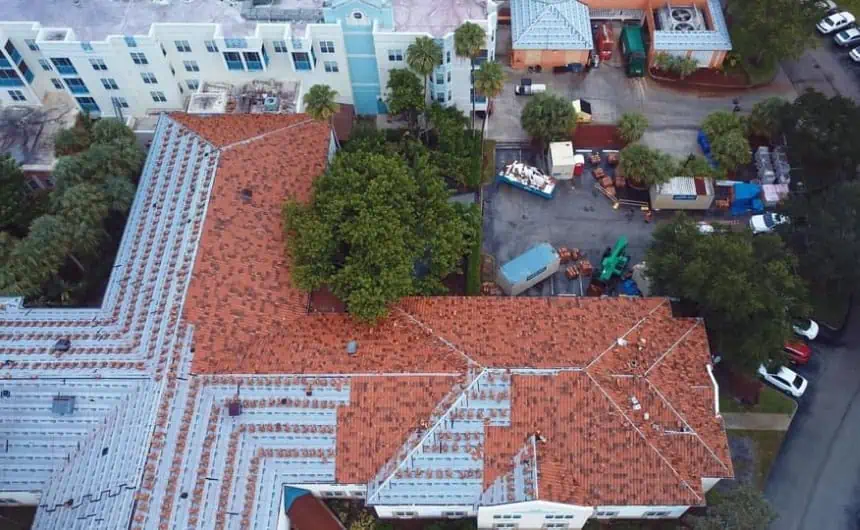 Aerial View: Stratfort Court Complex with Red-Tiled Roofs and Tree-Covered Parking