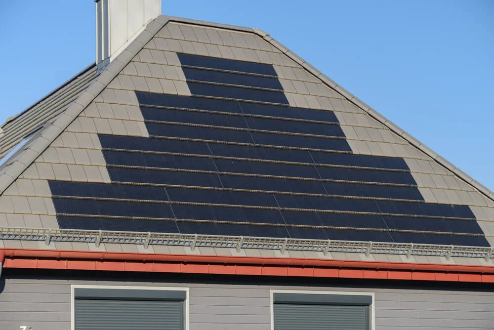 Solar roofing shingles integrated into a roofing system.