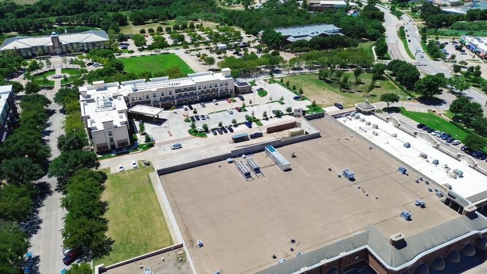 A birdseye view of a two-ply roof on a commercial building.